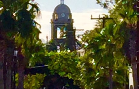 Tree lined street with Mission in the distance