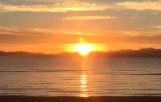 Walk the beach at sunrise