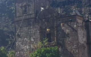 Old building with mountains in background