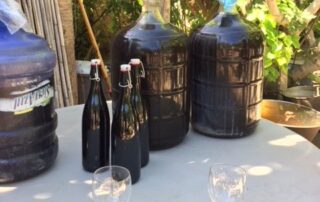 Wine bottles and decanters on table outdoors