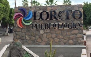 Pueblo Majico sign for Loreto