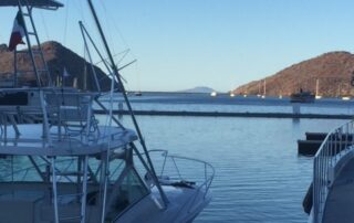 Fishing boats docked with view of ocean water