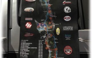 Car or truck with race course banner hanging from window