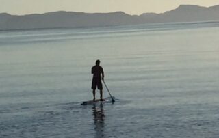 Person paddle boarding